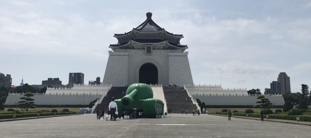 a large green object in front of Chiang Kai-shek Memorial Hall