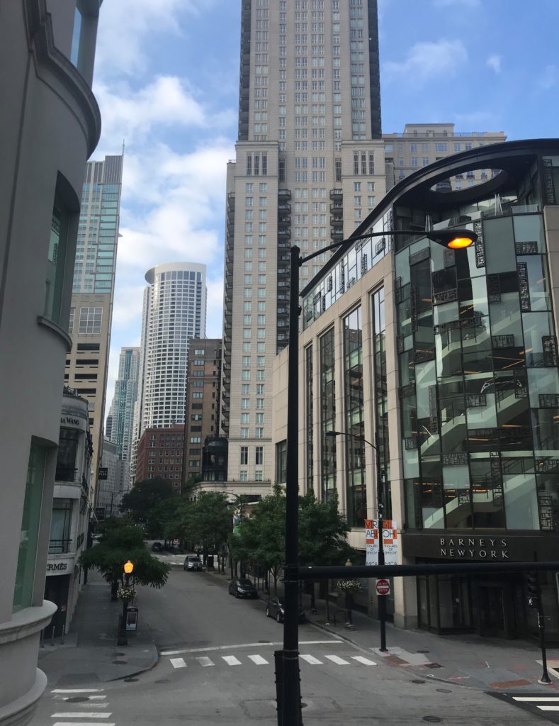 a street with tall buildings and a street light