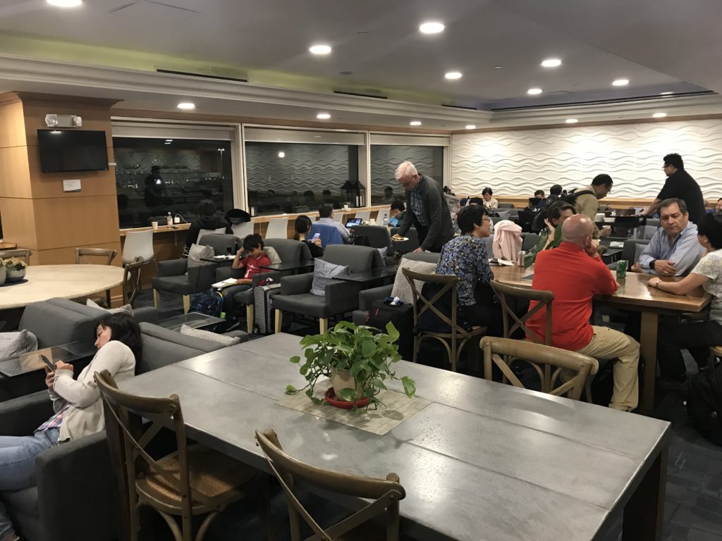 a group of people sitting at tables in a room