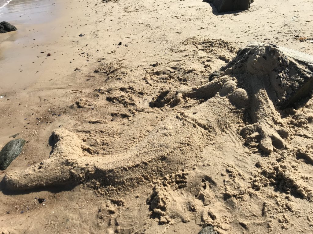a sand sculpture on a beach