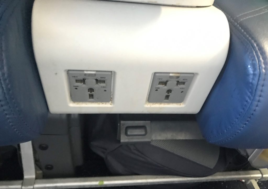 an electrical outlet in a plane