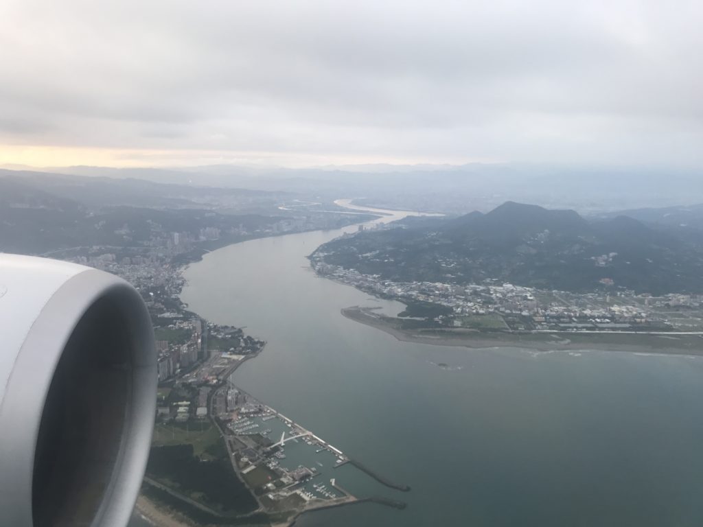a view of a river and city from an airplane