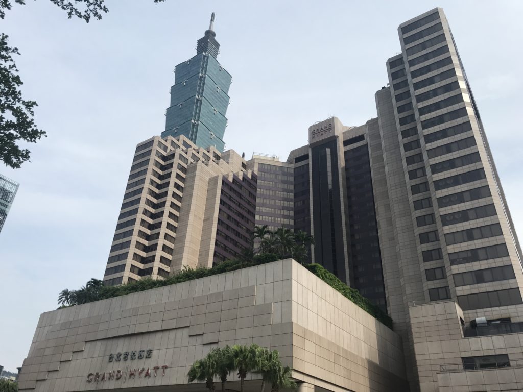 a building with a tall tower in the background