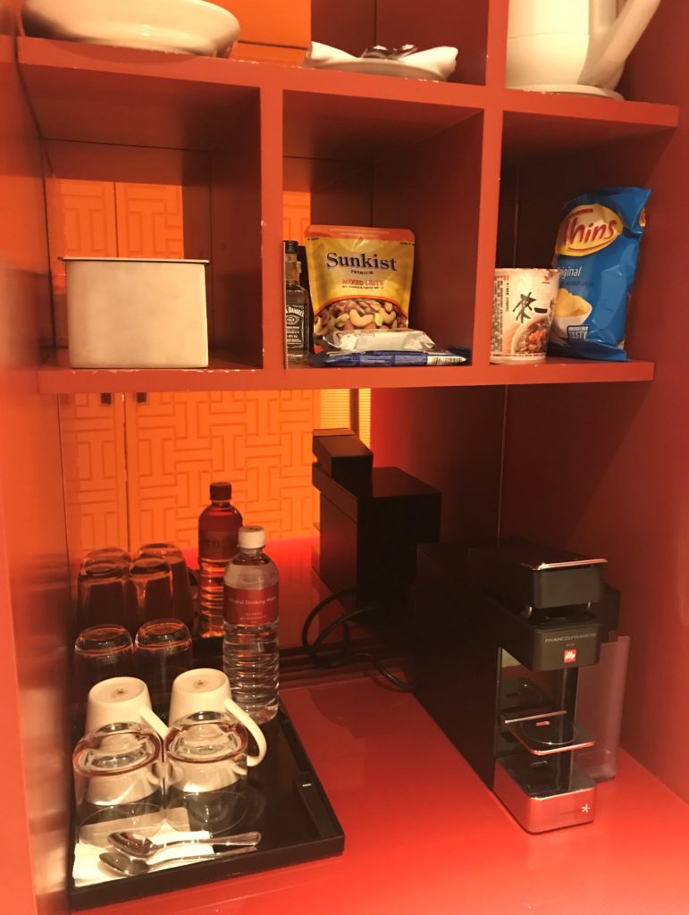 a shelf with food and drinks on it