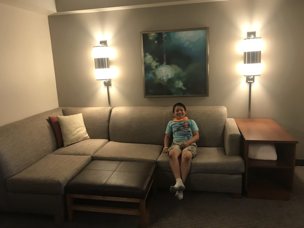 a boy sitting on a couch