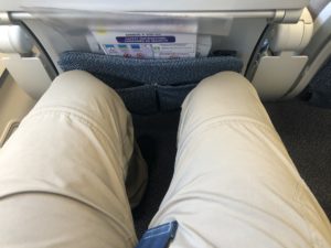 a person's legs in a seat