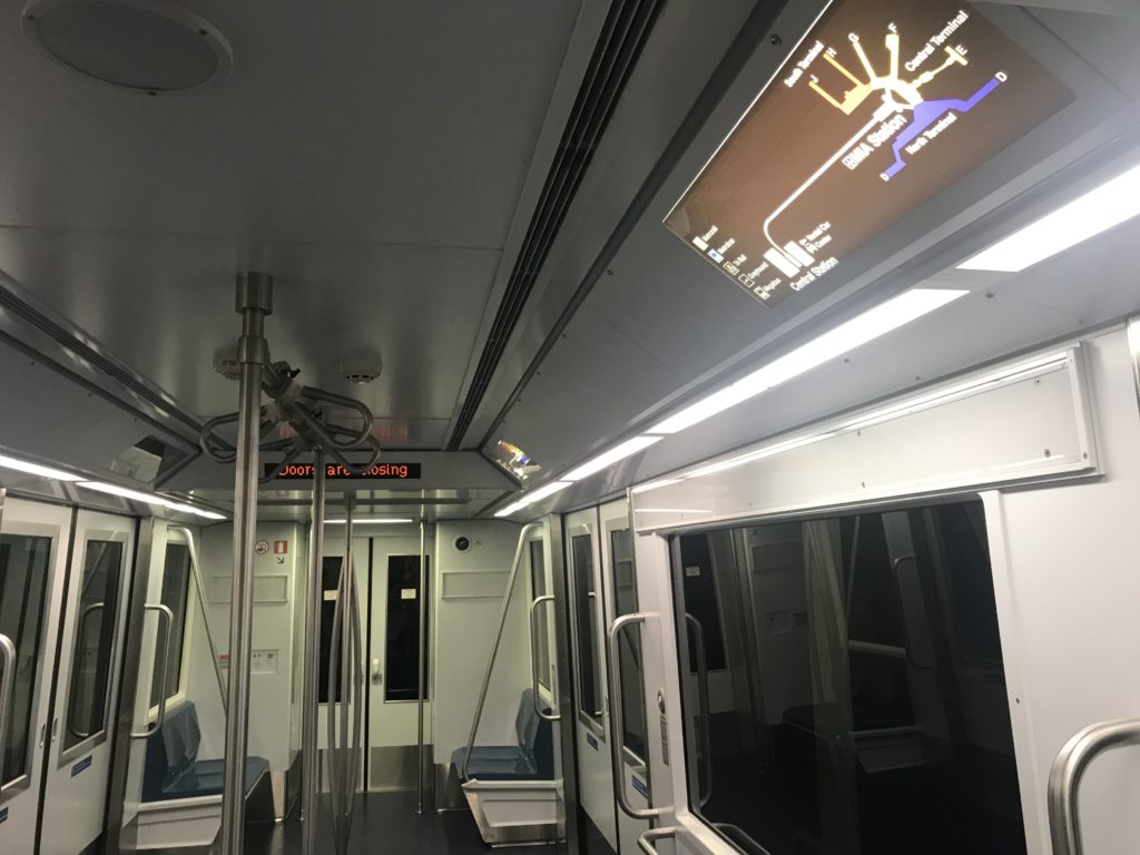 a subway with a digital screen
