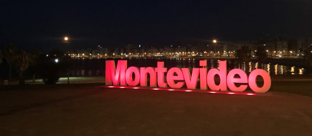 a large red sign with lights on it