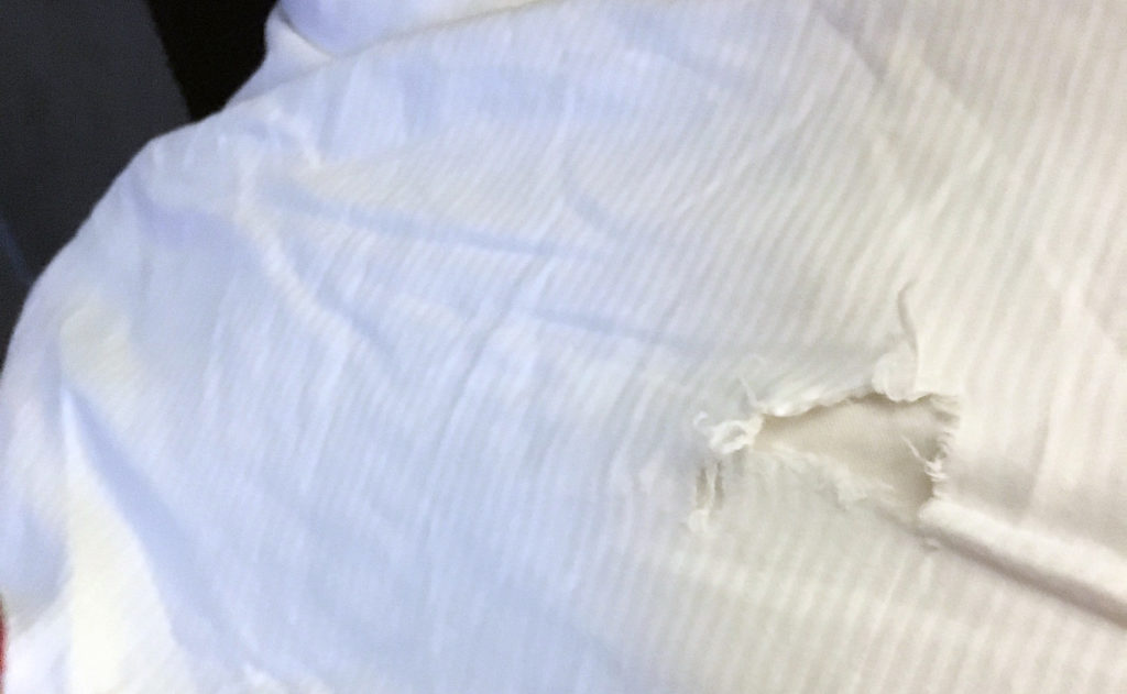 a white fabric with a hole in it
