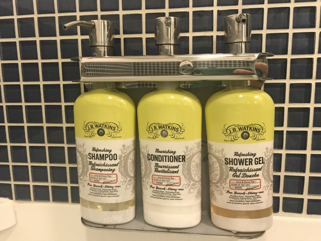 a group of shampoo bottles on a shelf