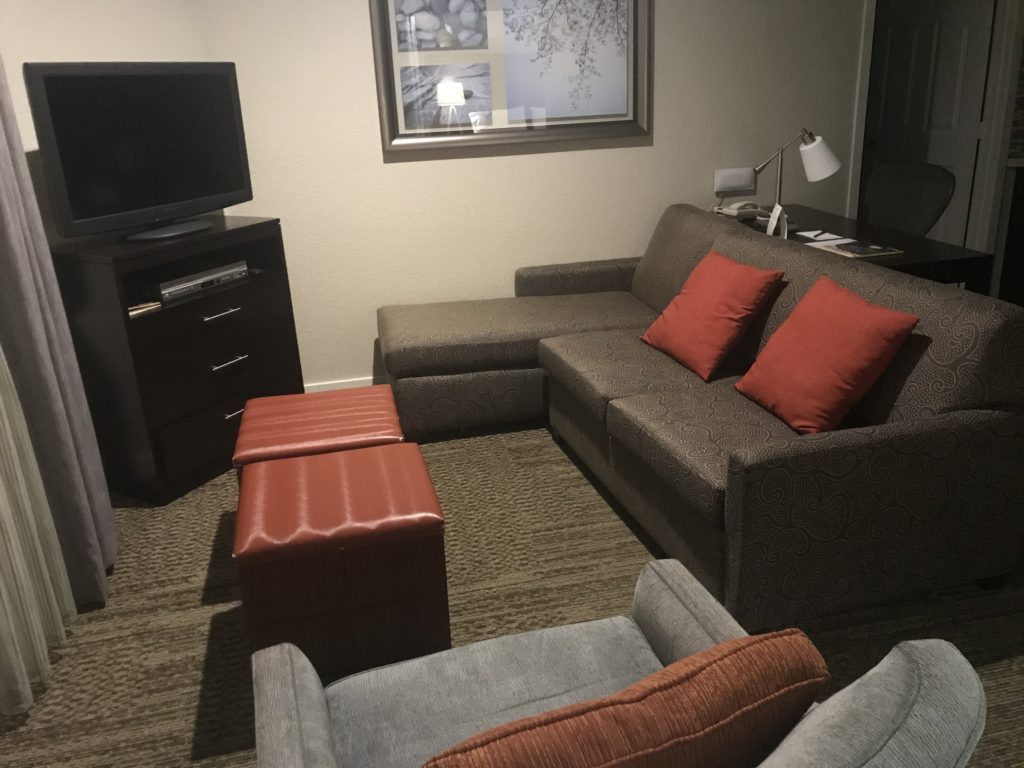 a couch and chair in a room