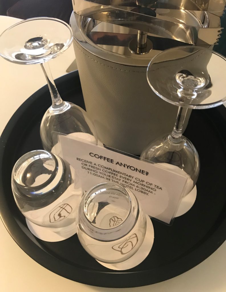 a group of wine glasses on a tray