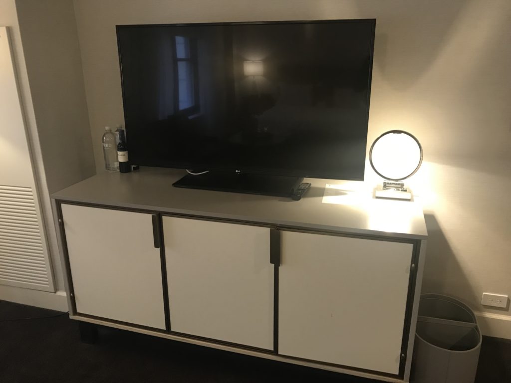 a tv on a cabinet