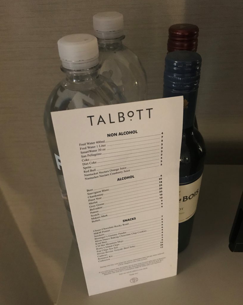 a bottle of alcohol and a paper