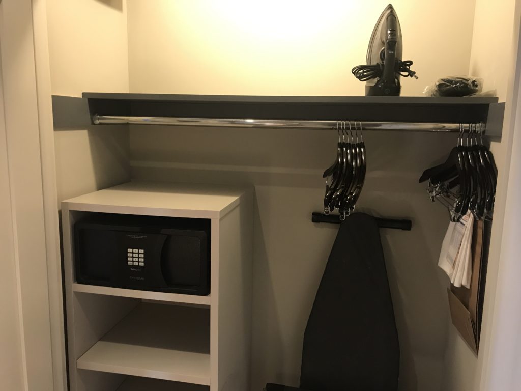 a iron and clothes rack in a room