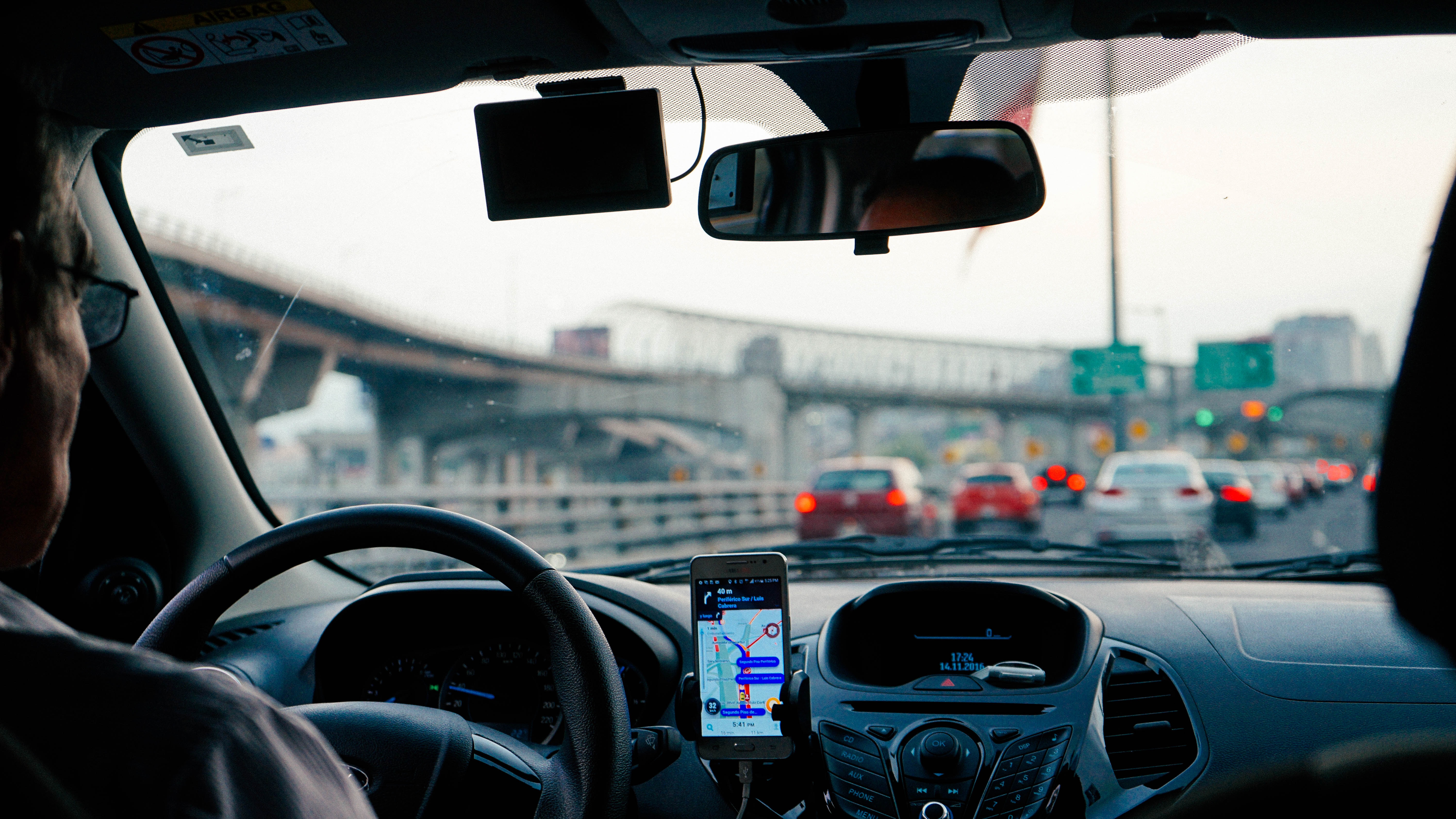 a car with a phone on the dashboard