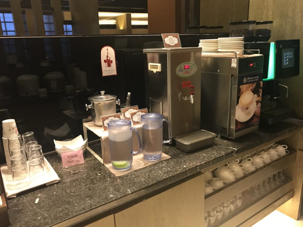 a counter with a machine and cups on it