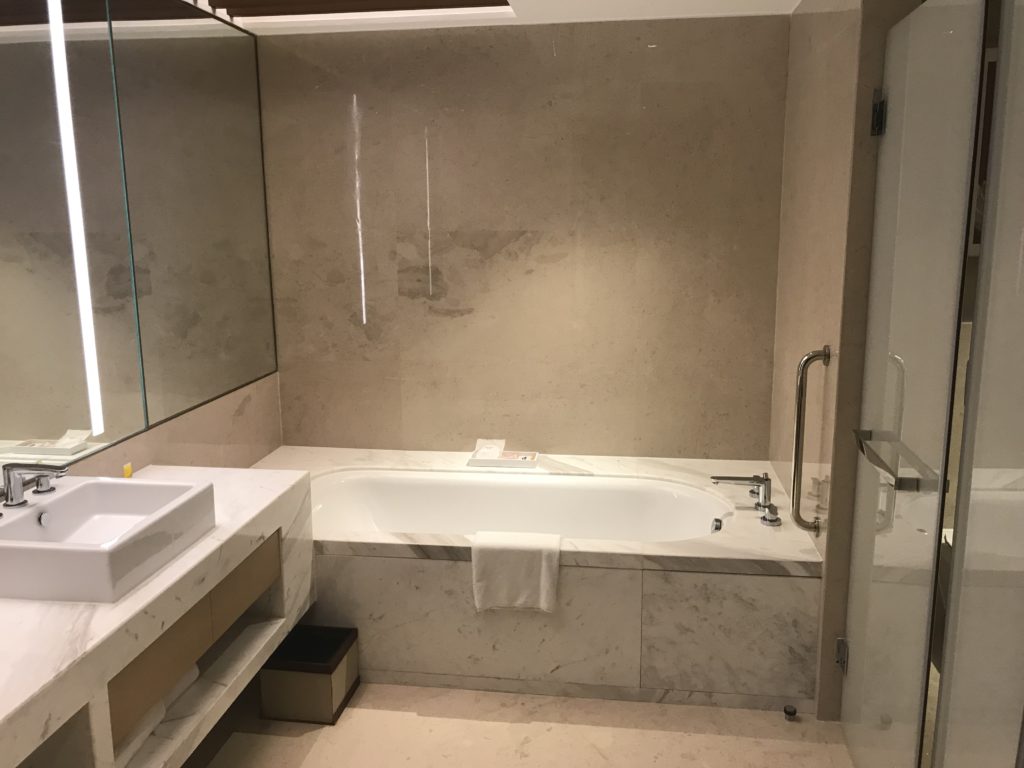 a bathroom with a bathtub and sink