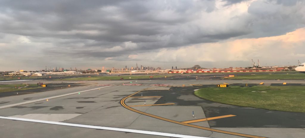 a runway with a city in the background