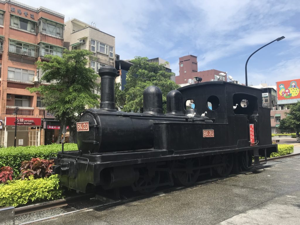 a black train on a street