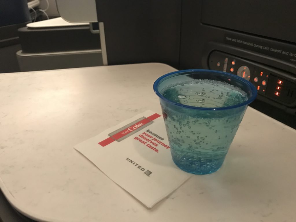 a blue plastic cup on a table