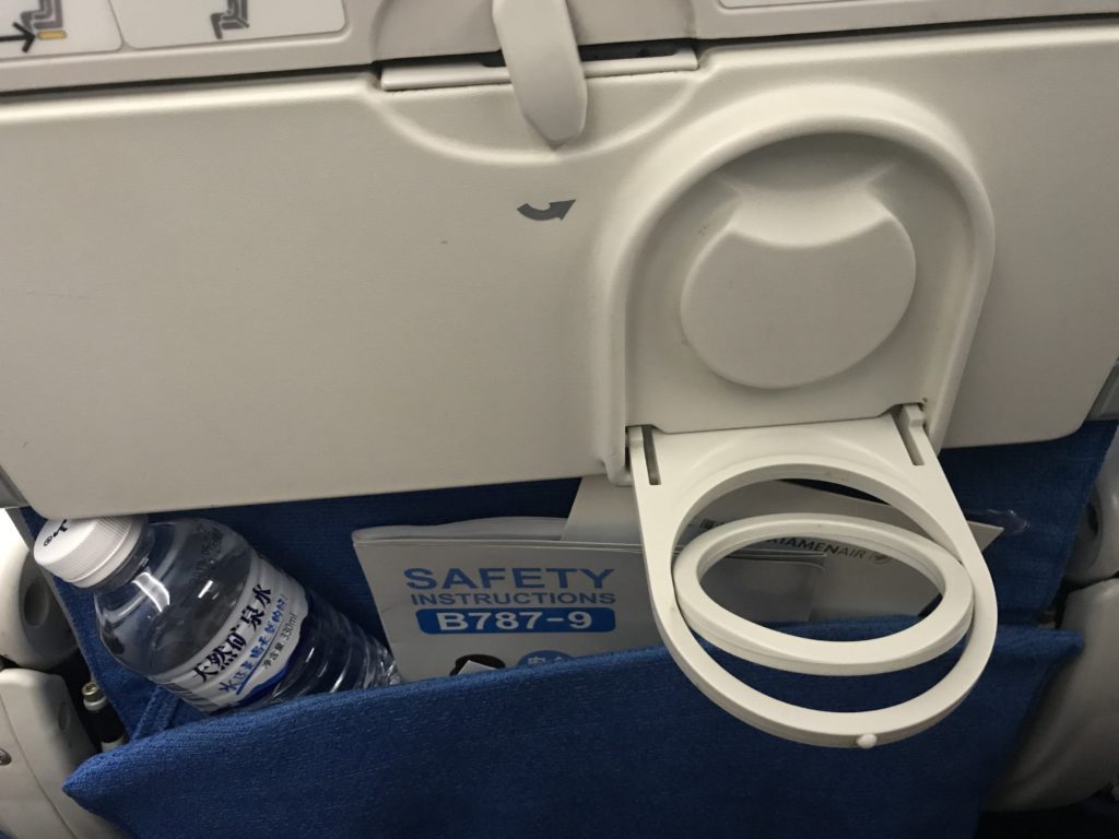 a seat with a drink bottle in the pocket