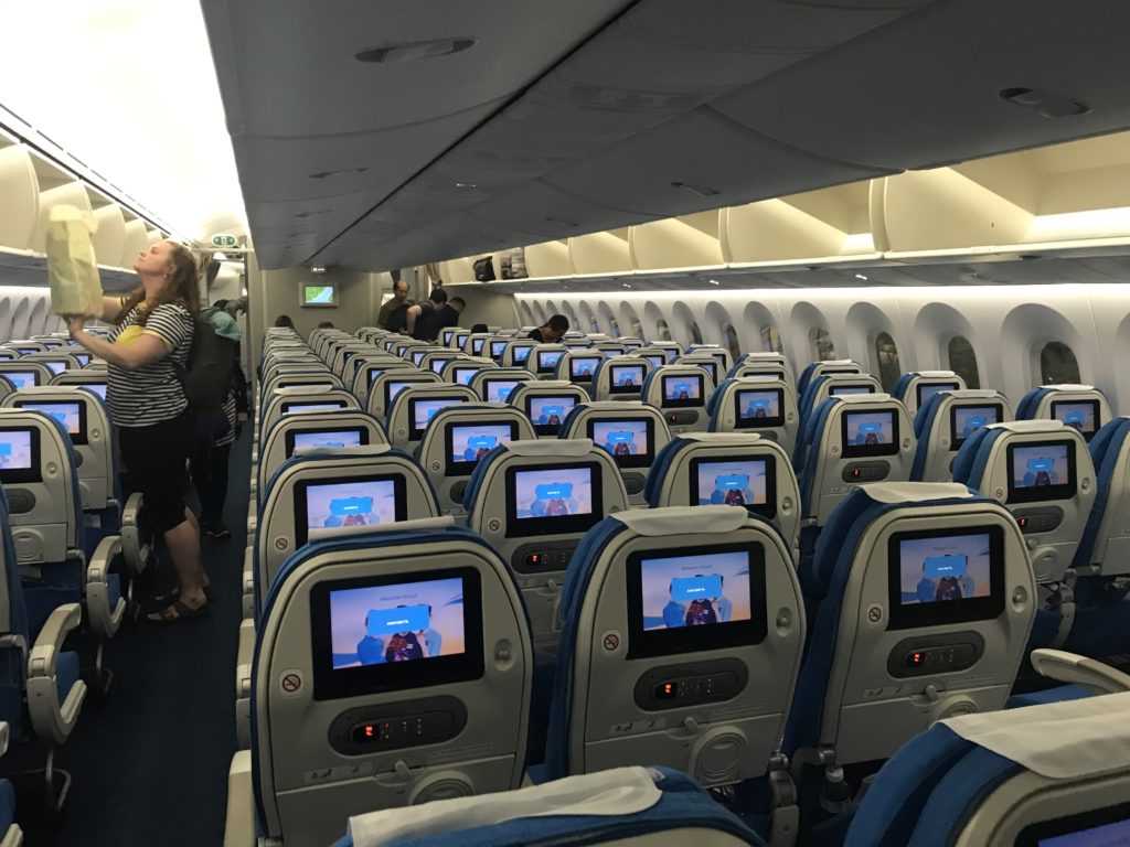 a group of seats with monitors on them