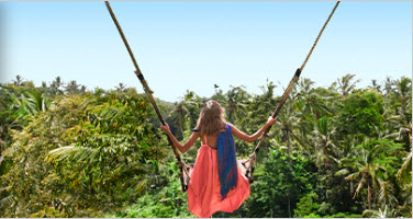 a woman swinging on a swing