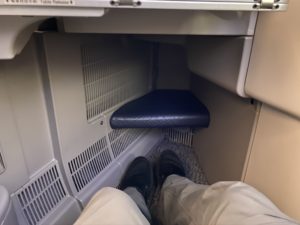 a person's legs in a seat