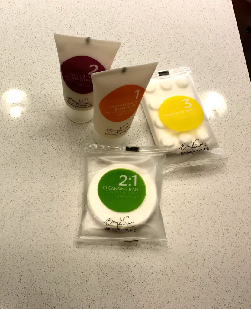 a group of packages of facial cleansing products