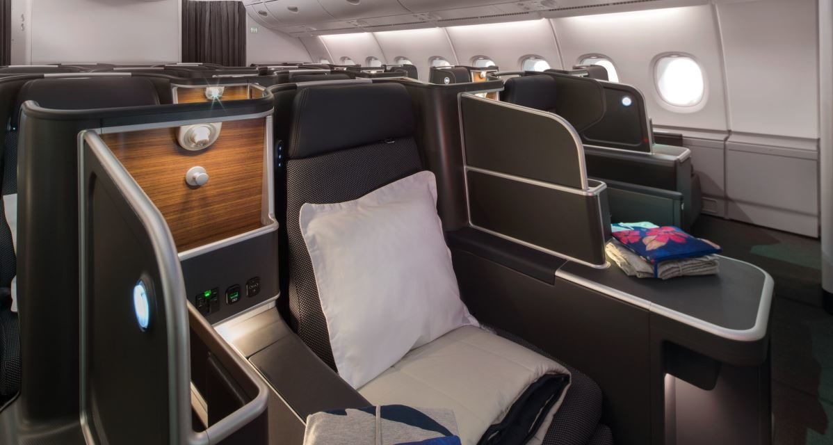 Why does Qantas say its business class is “mini-first”?