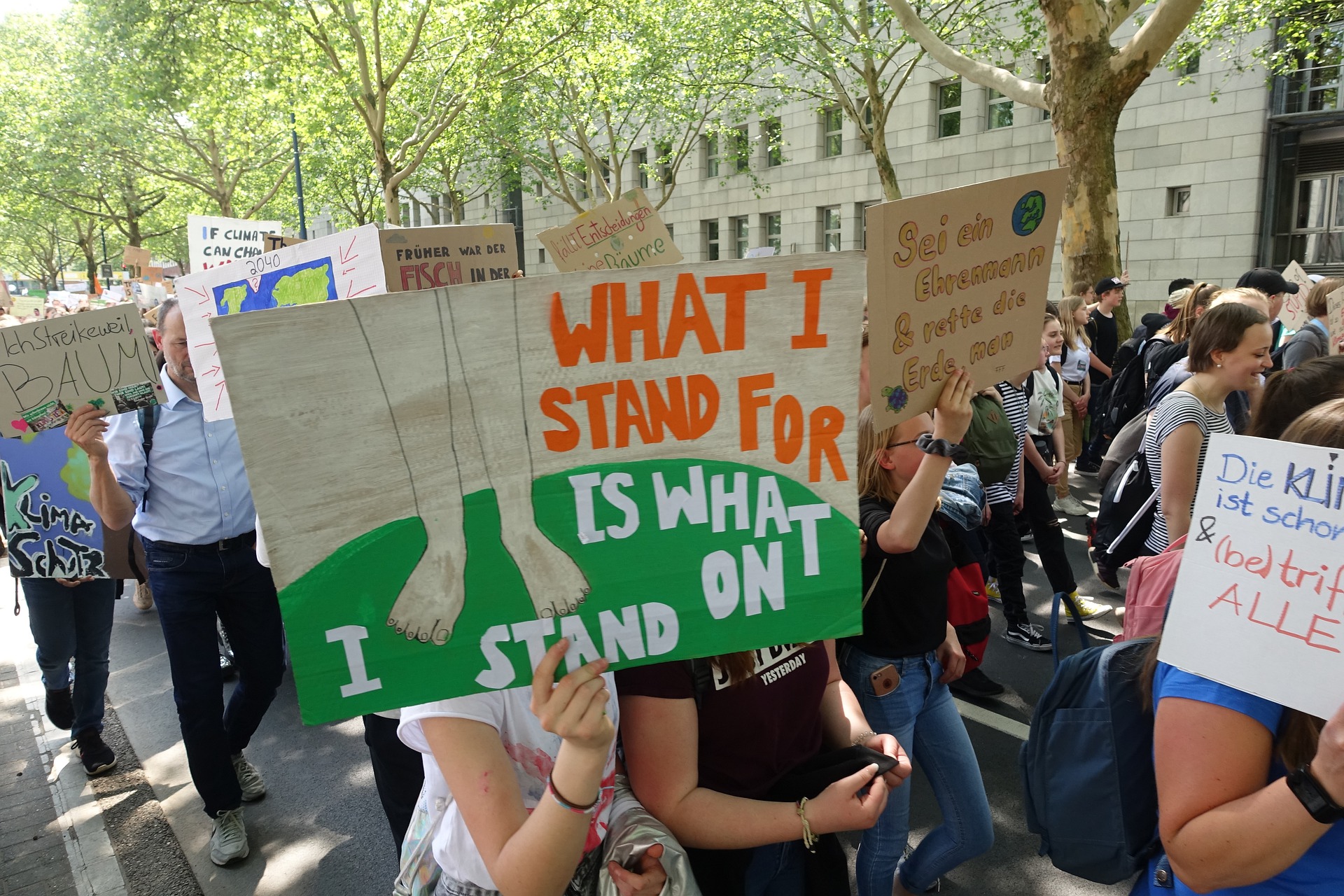 a group of people holding signs