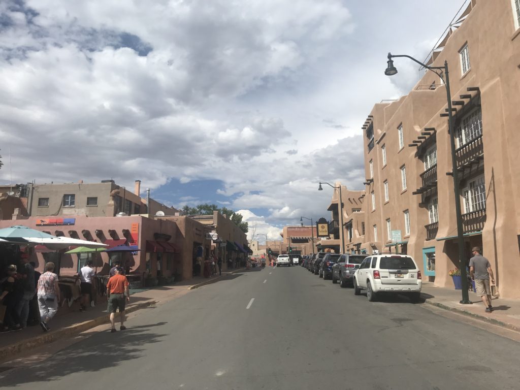 a street with cars and buildings