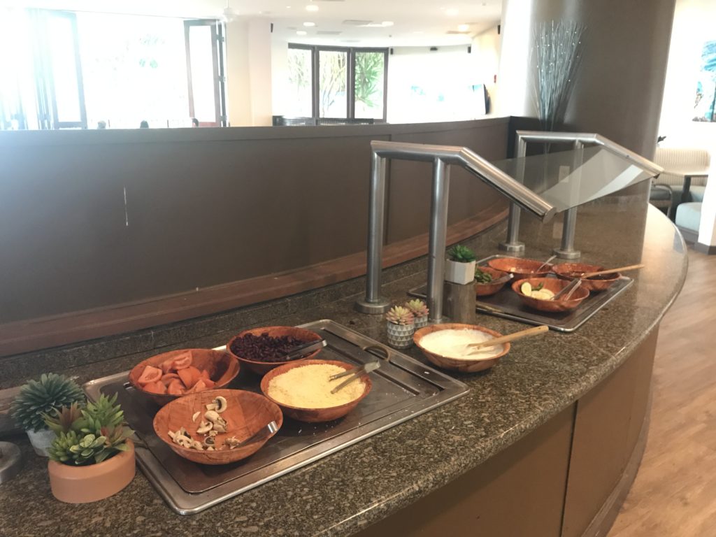 a counter with bowls of food on it