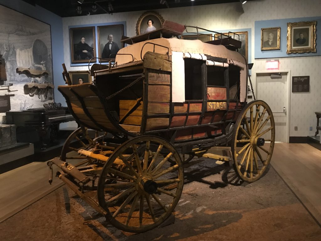 a horse drawn carriage in a museum