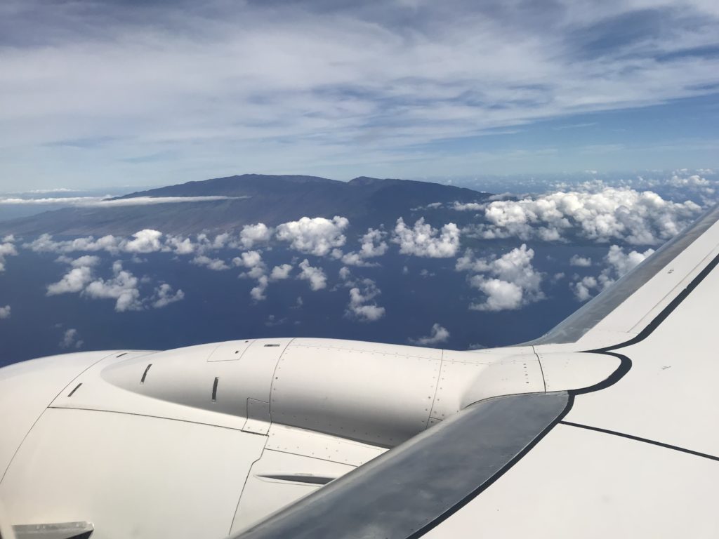 an airplane wing and clouds