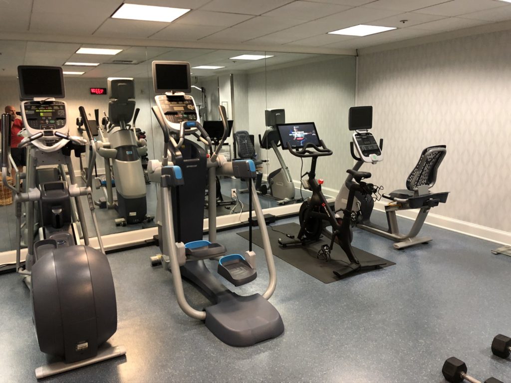 a room with exercise bikes and machines