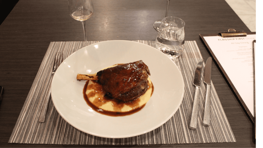 Lamb chops served on a bed of polenta