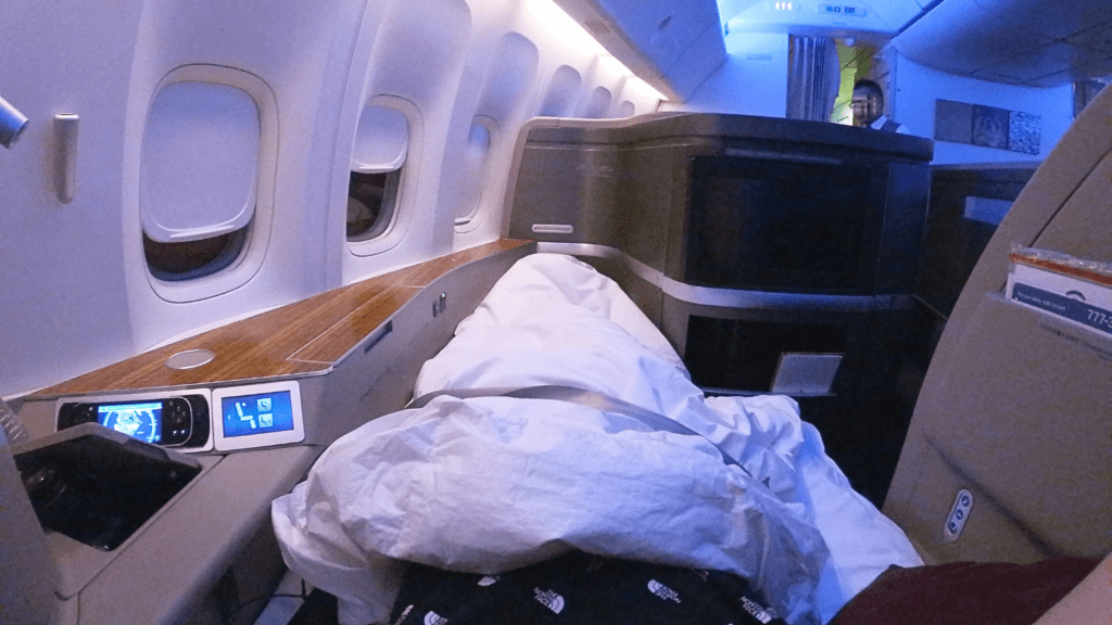 a person sleeping in an airplane