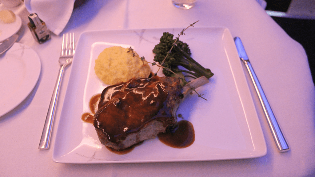 Pork chops main course aboard Cathay Pacific in first class