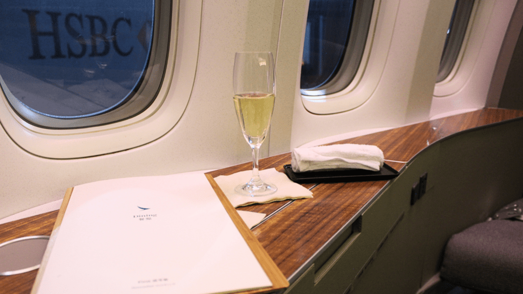 A glass of champagne in first class served before a Cathay Pacific flight from New York to Vancouver