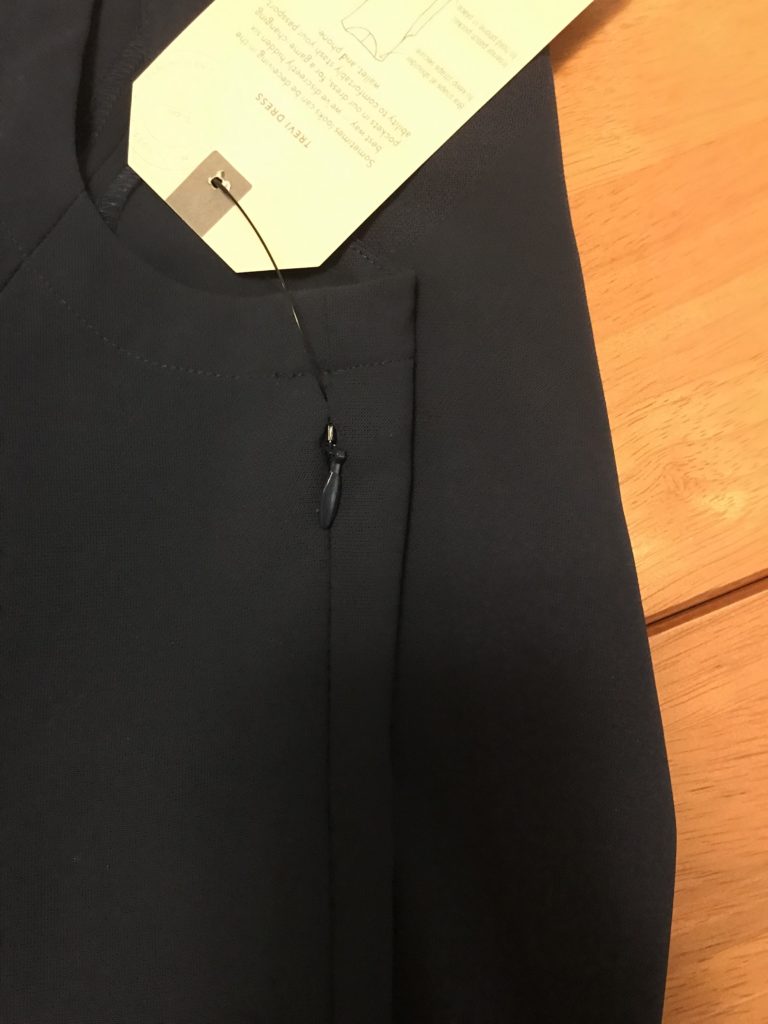 a black shirt with a tag on it