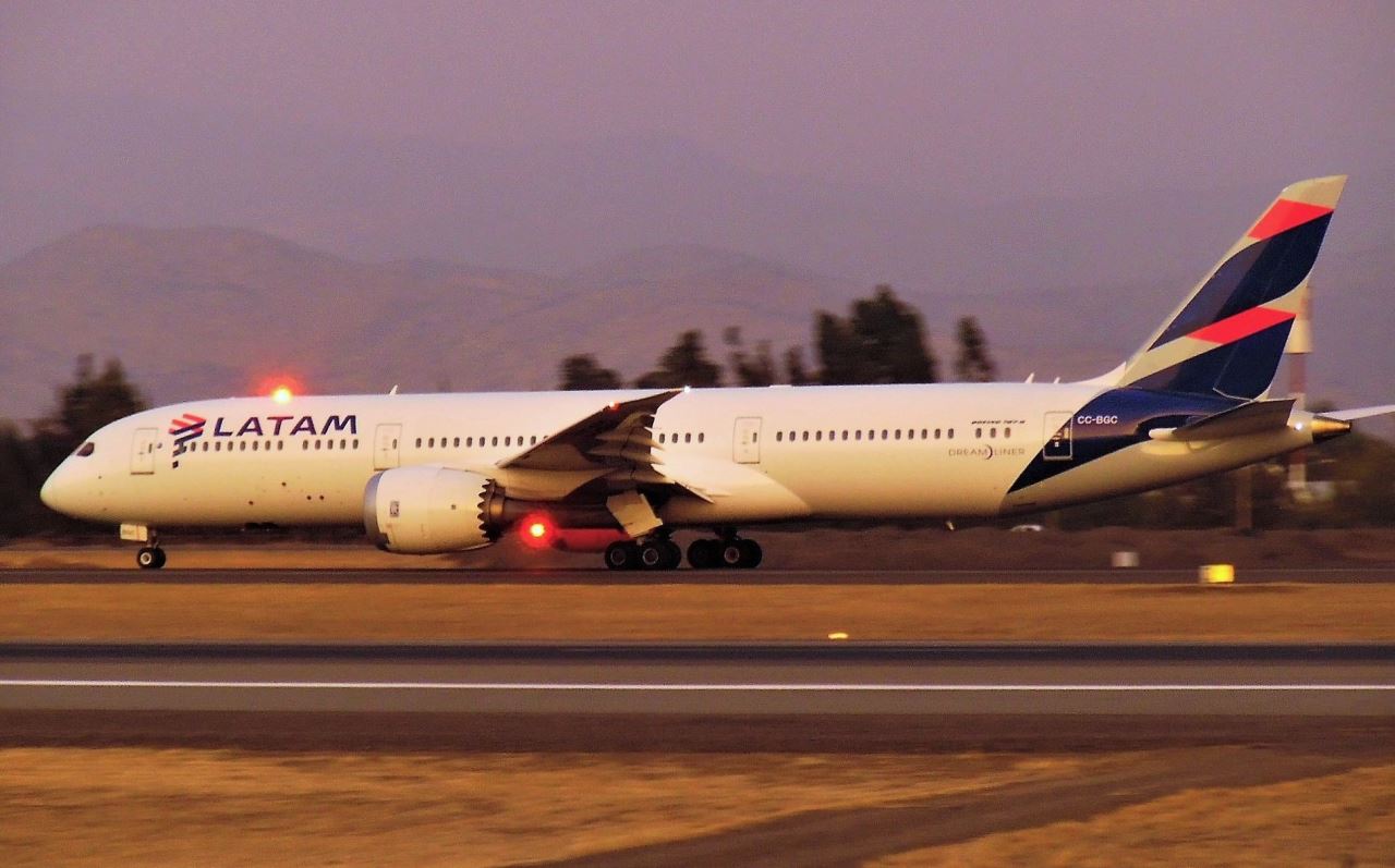 a large white airplane on a runway