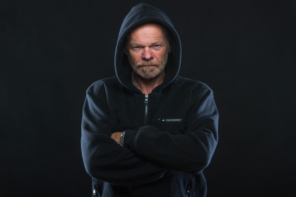 a man in a black hoodie