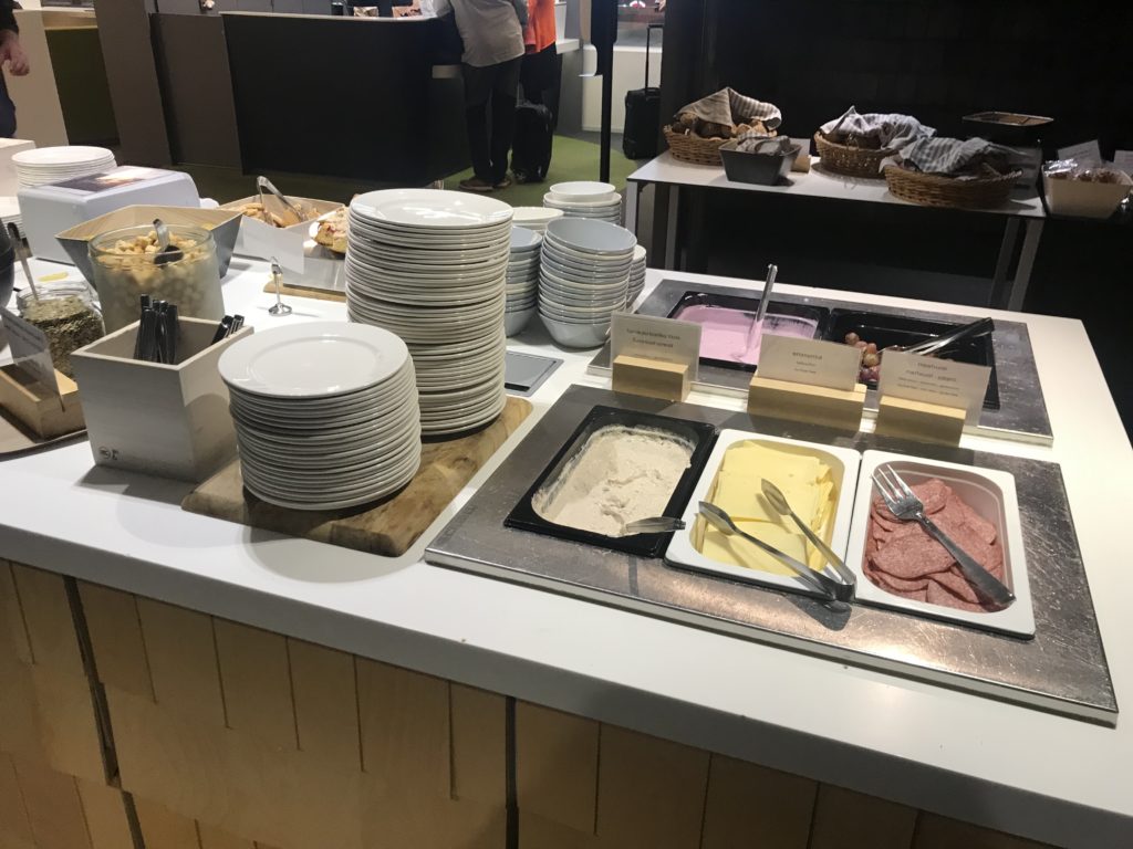 a buffet table with plates and food