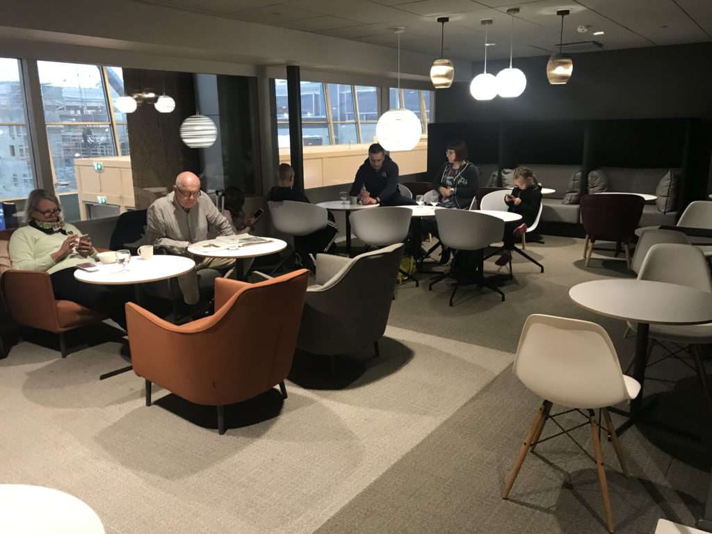 a group of people sitting at tables in a room
