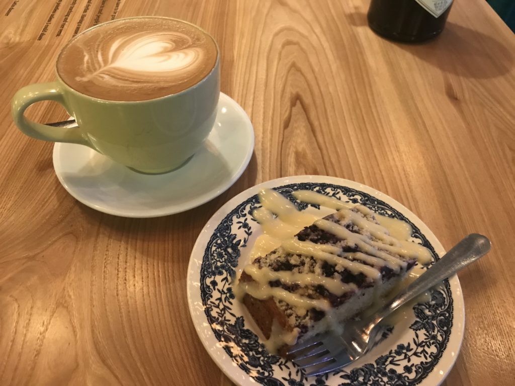 a plate of cake and a cup of coffee