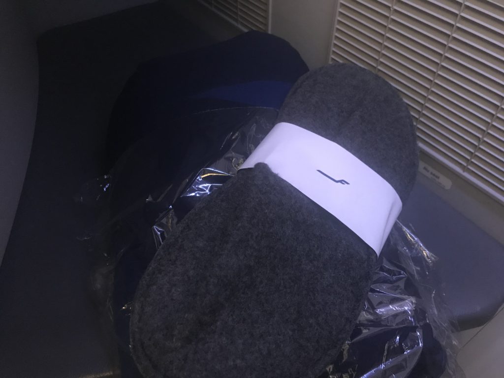 a pair of slippers on a bag