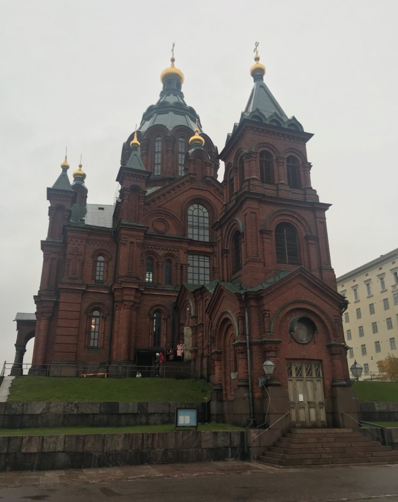 a building with a steeple and a door