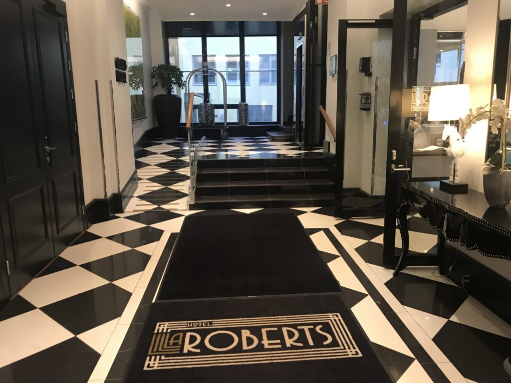 a black and white checkered floor with a black and white rug